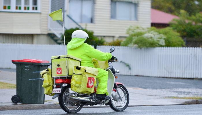 postie on motorcycle